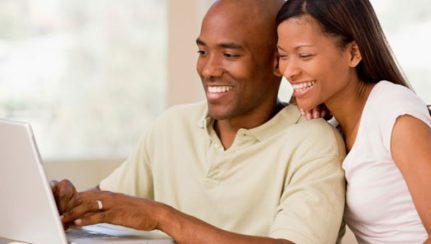 Couple Using Online Rental Tool